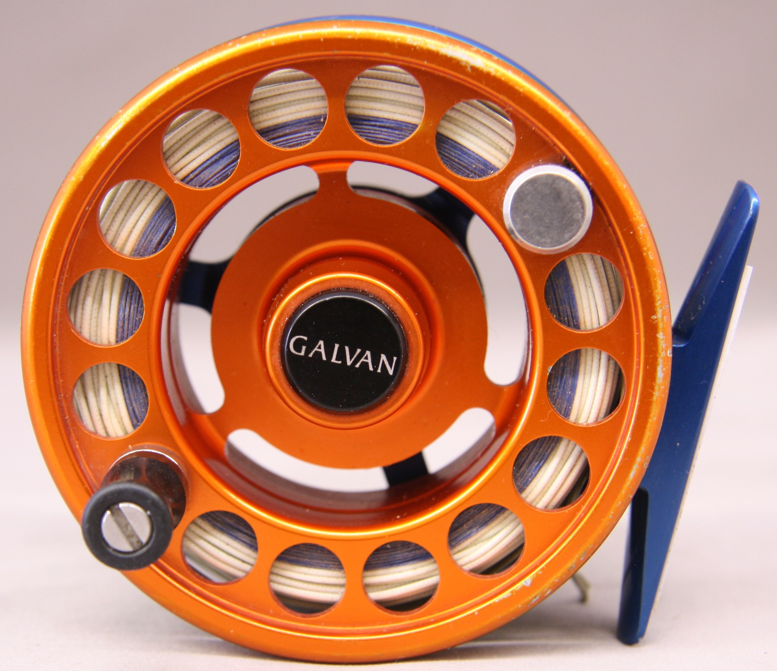 Galvan Model Rush-4-LT  fly reel with orange and blue anodized finish. Bronco colors. Preview